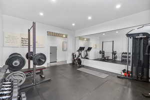 Exercise room featuring recessed lighting and baseboards