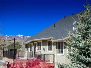 Exterior space featuring back of home & deck
