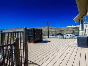 Deck with a mountain view & generator hut