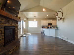 living room with vaulted ceiling