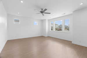 Unfurnished room with recessed lighting, visible vents, ceiling fan, and light wood-style flooring