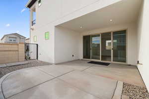 View of patio / terrace featuring fence and a gate