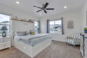 Bedroom with light colored carpet, recessed lighting, and baseboards