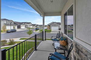 Balcony featuring a residential view and a porch