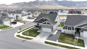 Birds eye view of property with a residential view and a mountain view