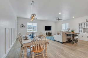 Dining area with a healthy amount of sunlight, recessed lighting, and light wood-style flooring