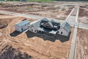 Birds eye view of property with a rural view