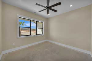 Spare room with recessed lighting, concrete floors, baseboards, visible vents, and a ceiling fan