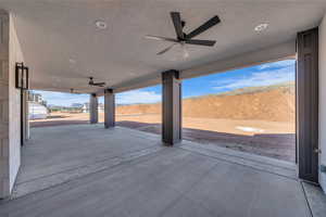 View of patio featuring a ceiling fan and a mountain view