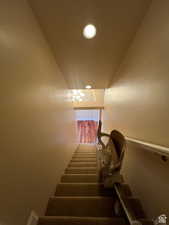 Staircase featuring recessed lighting