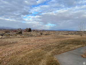 View of yard with a rural view