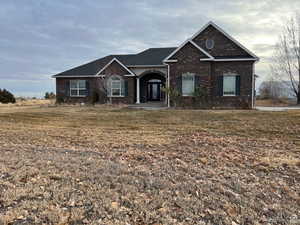 View of front of home featuring brick siding