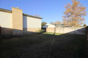 View of yard with fence