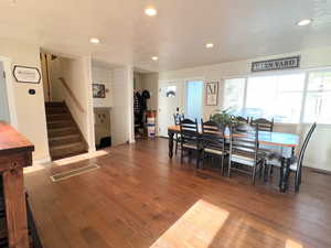 Dining room with recessed lighting, visible vents, stairway, and wood finished floors