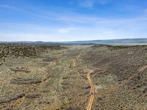 View looking s down first valley with north boundary and home in the distance