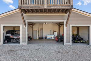 Garage with gravel driveway