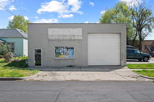 Exterior space featuring concrete driveway