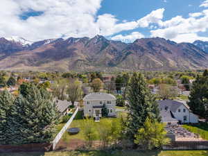 Property view of mountains with a residential view