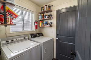 Laundry area featuring washing machine and dryer and laundry area