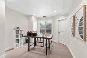Office area with recessed lighting, carpet, visible vents, and baseboards
