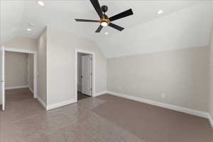 Additional living space featuring recessed lighting, lofted ceiling, baseboards, and ceiling fan