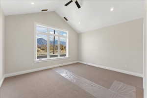 Carpeted spare room featuring a ceiling fan, baseboards, recessed lighting, and vaulted ceiling