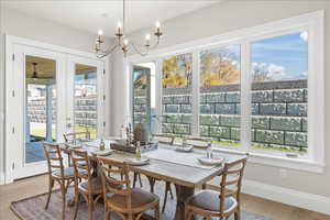 Interior space featuring french doors and a notable chandelier