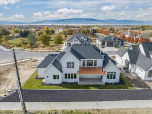 Drone / aerial view featuring a residential view and a mountain view