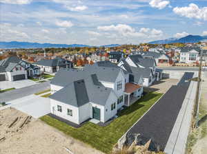 Drone / aerial view with a mountain view and a residential view
