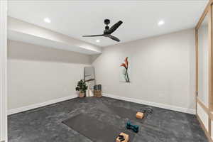 Exercise area with recessed lighting, baseboards, and ceiling fan