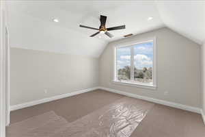 Bonus room with vaulted ceiling, carpet, and recessed lighting