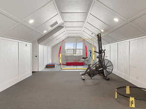 Exercise room with recessed lighting, visible vents, and lofted ceiling