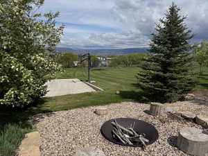View of green lawn with a mountain view