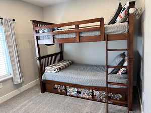 Bedroom featuring baseboards and carpet flooring
