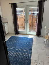 Interior space featuring french doors and baseboards
