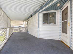 View of patio with a carport