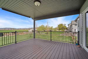 Deck featuring a lawn and a mountain view