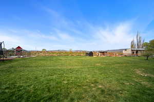 View of yard featuring fence