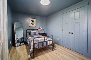 Bedroom featuring visible vents and light wood finished floors