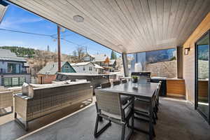 Exterior space with an outdoor hangout area, outdoor dining space, a residential view, and plenty of natural light
