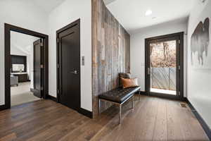 Interior space with visible vents, baseboards, wood finished floors, and recessed lighting
