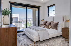 Bedroom with recessed lighting and access to exterior