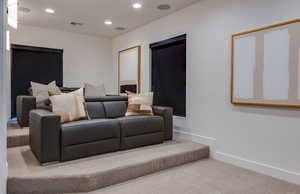 Carpeted bedroom with recessed lighting, visible vents, and baseboards