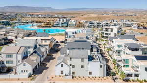 Birds eye view of property with a mountain view and a residential view