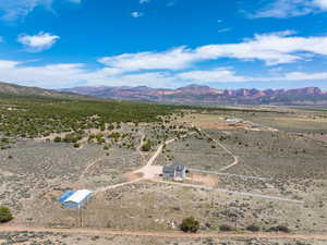 Bird's eye view featuring view of desert, a mountain view, and a rural view
