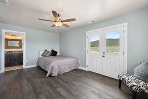 Bedroom featuring visible vents, dark wood-style flooring, and baseboards