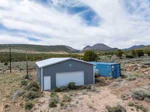 Detached garage featuring a mountain view