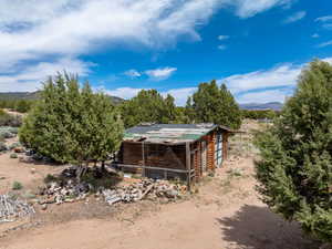 Exterior space featuring exterior structure, an outdoor structure, and a mountain view