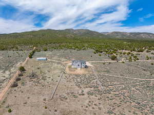 Birds eye view of property with a mountain view, a rural view, and a desert view