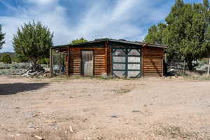 View of outbuilding with an outdoor structure